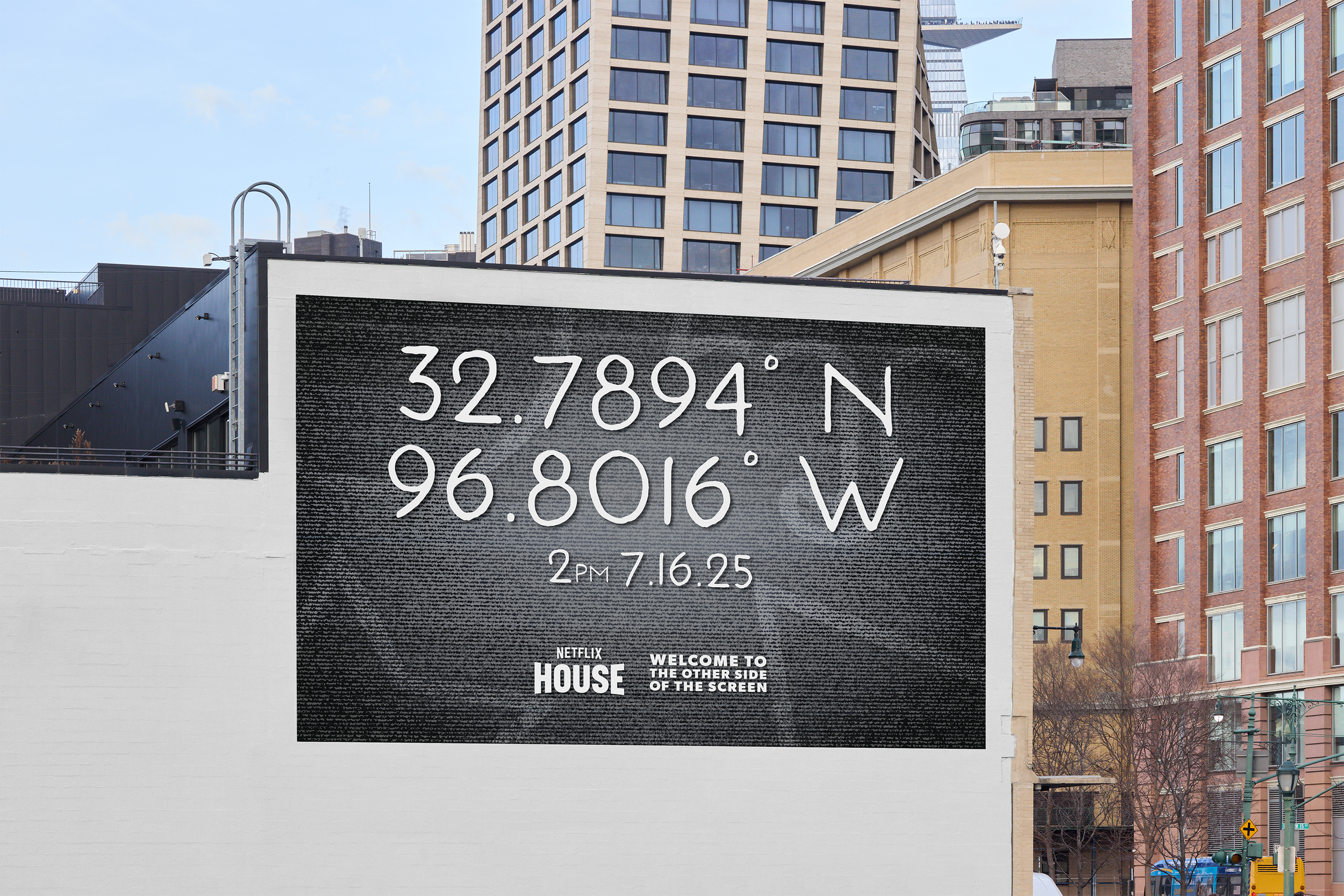A billboard displaying GPS coordinates, date, and time, with a cityscape of tall buildings in the background.