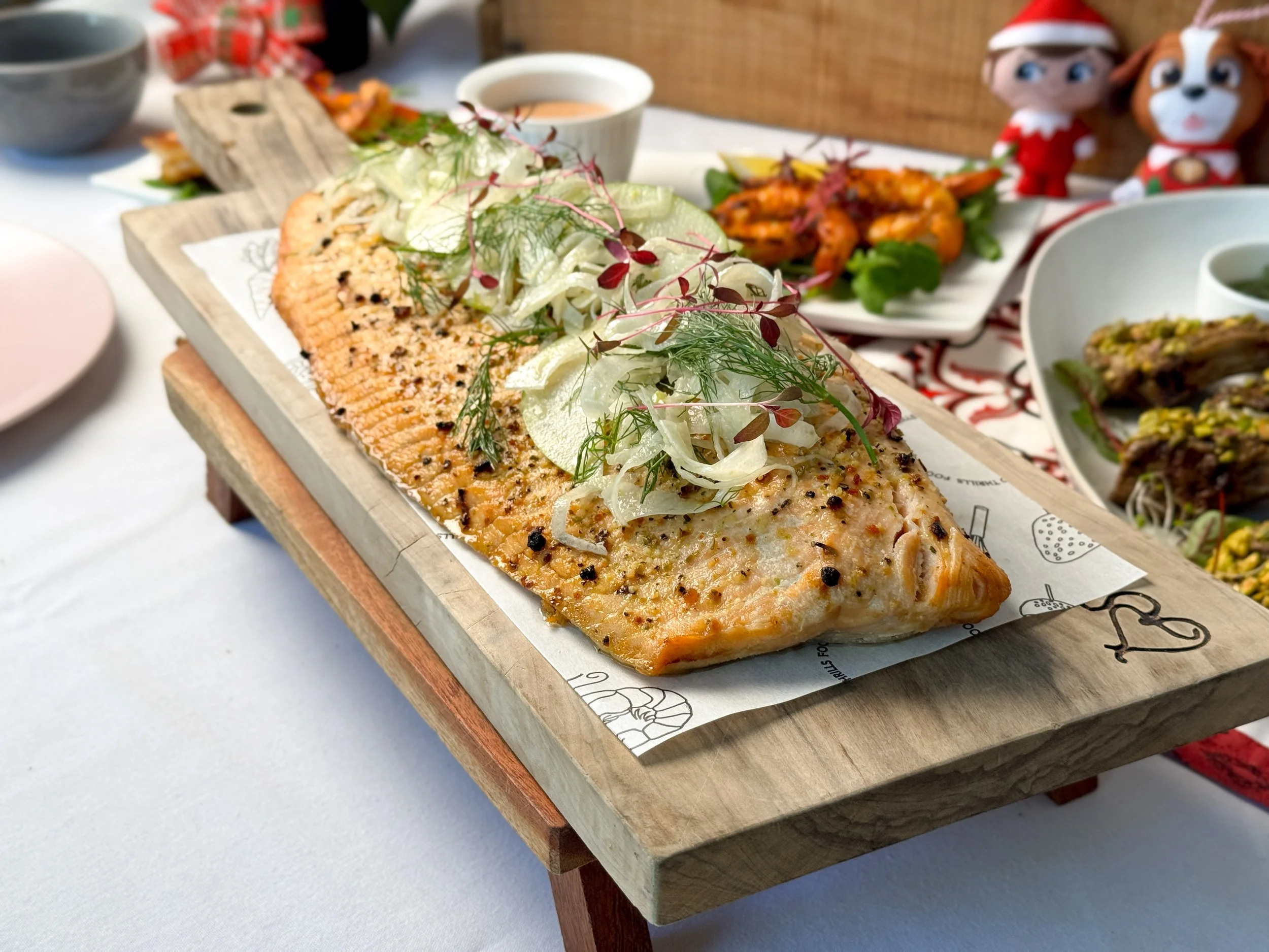 Chef Leo Iza Grilled whole side of salmon, apple, fennel slaw GF