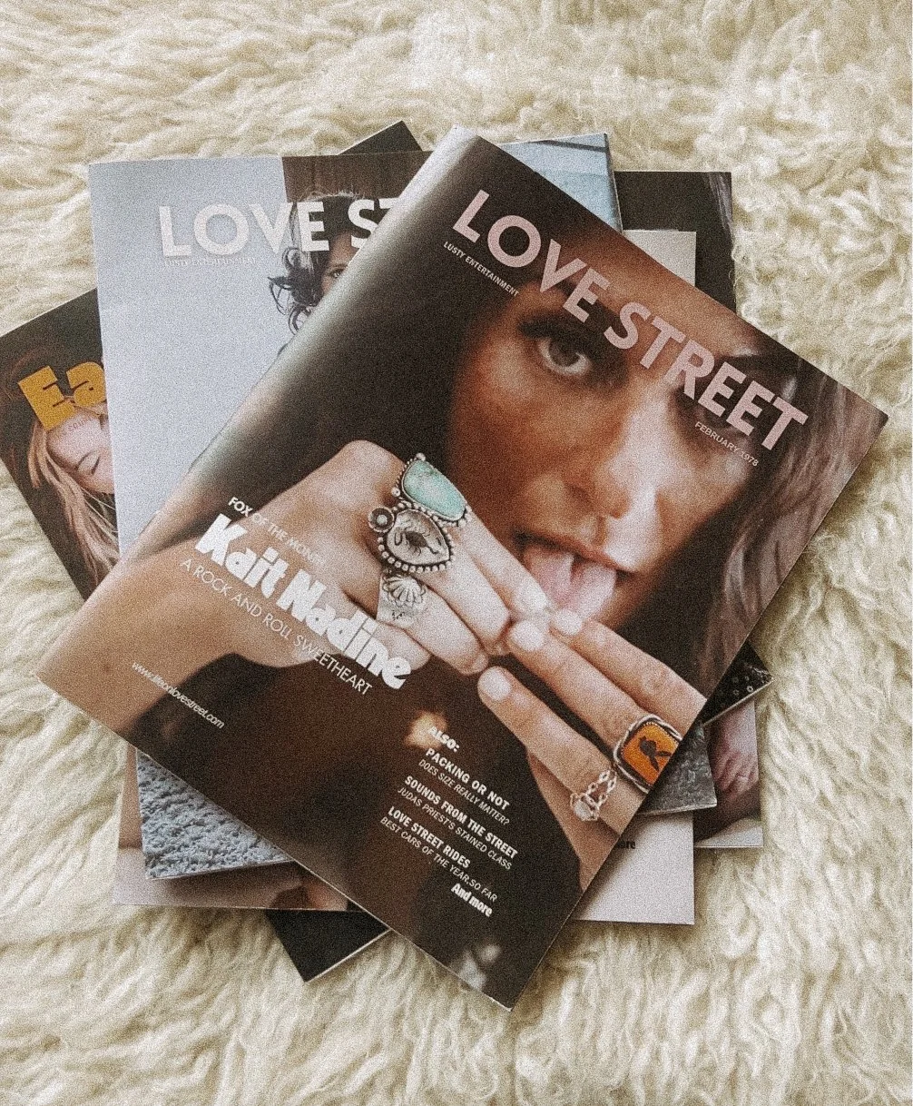 Stack of Love Street magazines featuring editorial portraits, personal stories, and custom magazine design.