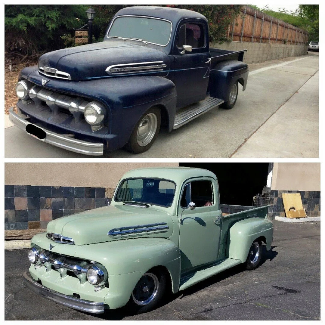 Two vintage pickup trucks, one dark blue and one light green, parked on the street. The blue truck is parked on the sidewalk, and the green truck is parked in a driveway or lot.