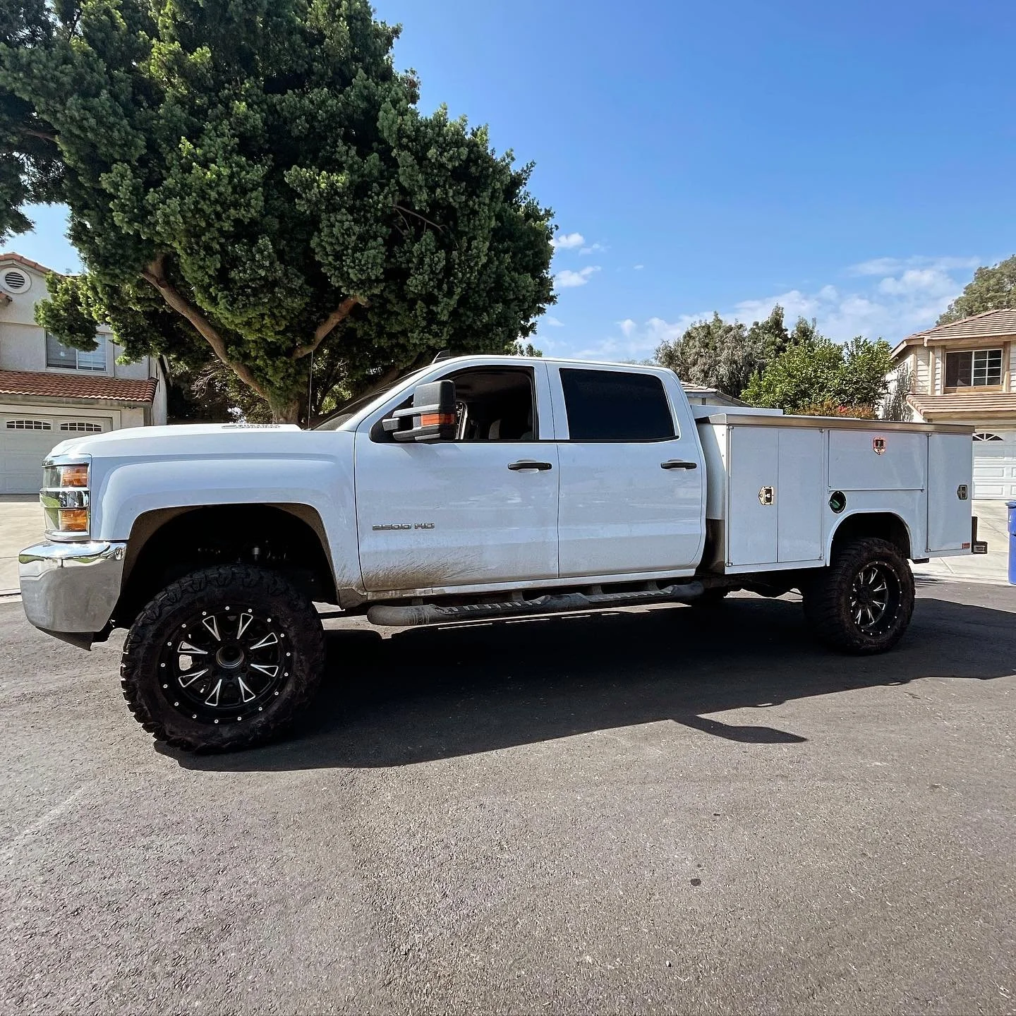 White service truck with tool boxes on back