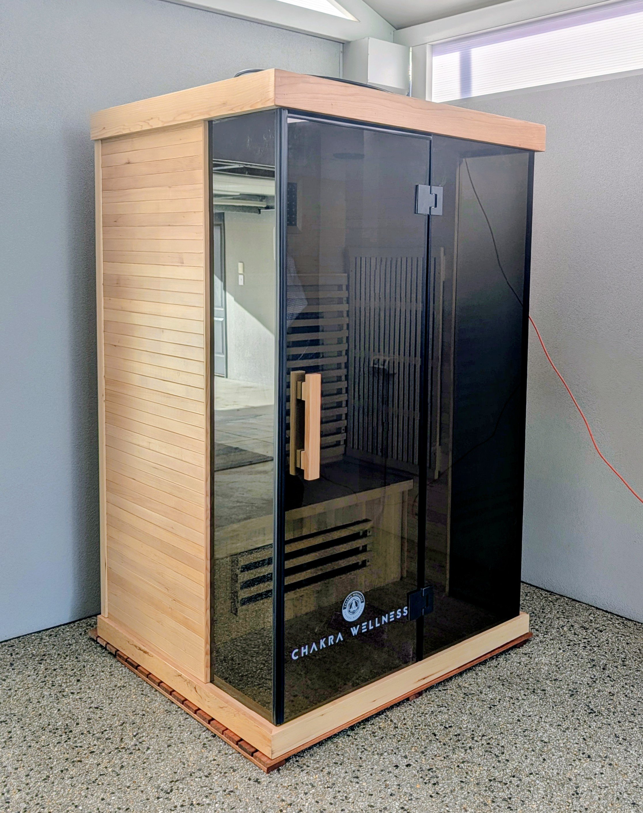 Chakra Wellness infrared sauna cabin in a Perth home, showing the compact size that runs on a standard 10A power point
