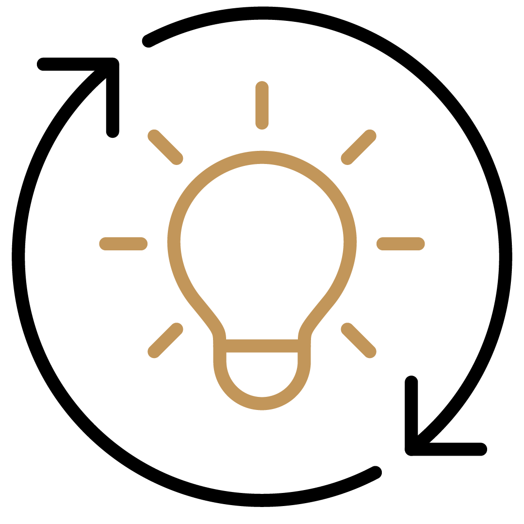 Symbol für eine Idee oder Inspiration, ein Glühbirne in Gold auf schwarzem Hintergrund.