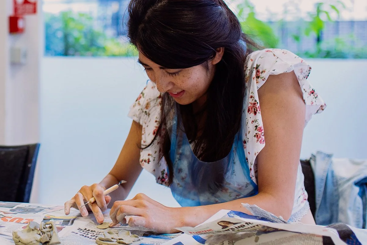 Woman-clay-modeling-smiling-pottery-creative.jpg