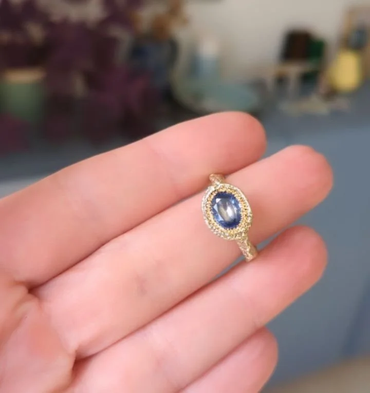A very pretty Oval Solitaire Stitch Ring in 14ct Yellow Gold and Sapphire 💙 This would make a great alternative engagement ring or gift for a special time in your life. 

The delicate hand stitched texture of thread covering this design and cast in 