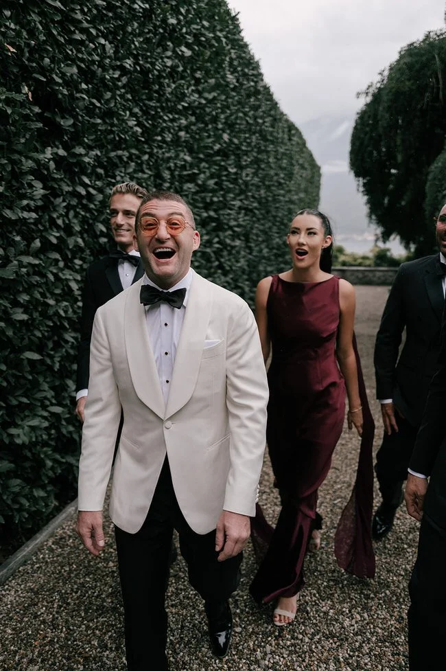 my-lake-como-wedding-italy-planner-groom-arriving-ceremony-white-jacket-happy