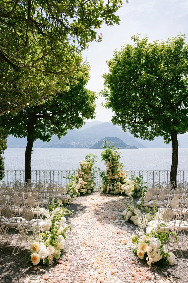 my-lake-como-wedding-planning-planner-expert-italy-aisle-guest-seating-mountains-beside-lake-romantic-white-florals