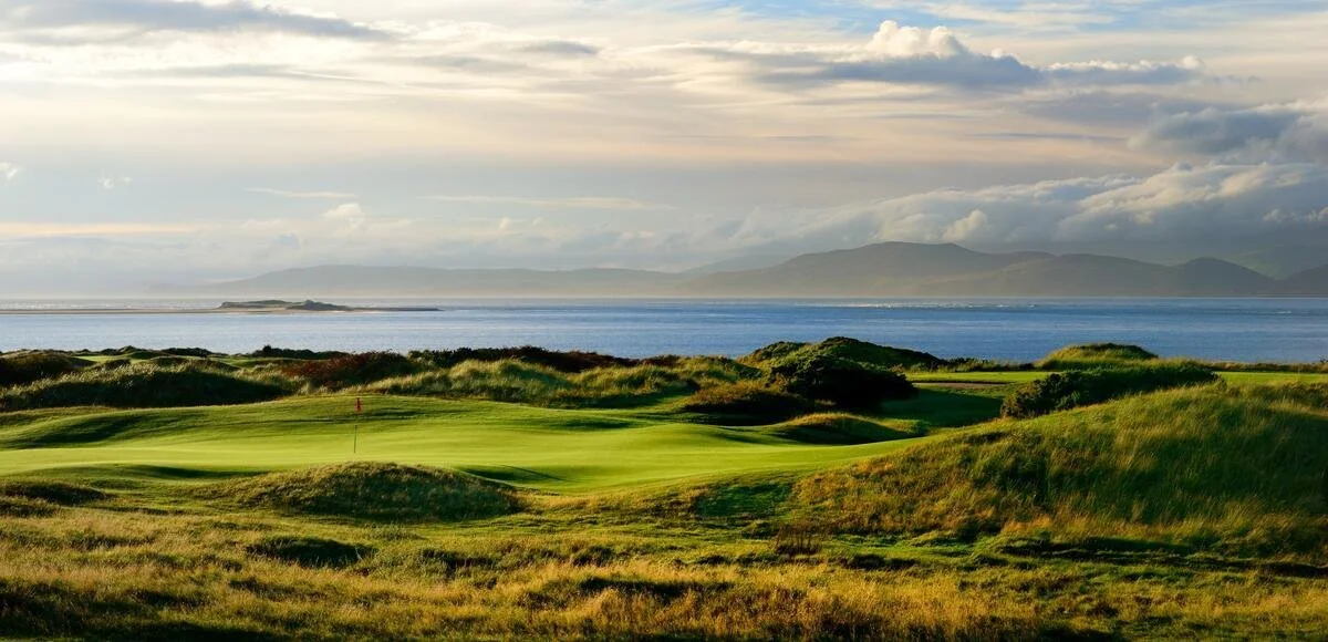 Dooks Golf Club links course overlooking Dingle Bay with coastal fairways and the MacGillycuddy’s Reeks in County Kerry, Ireland