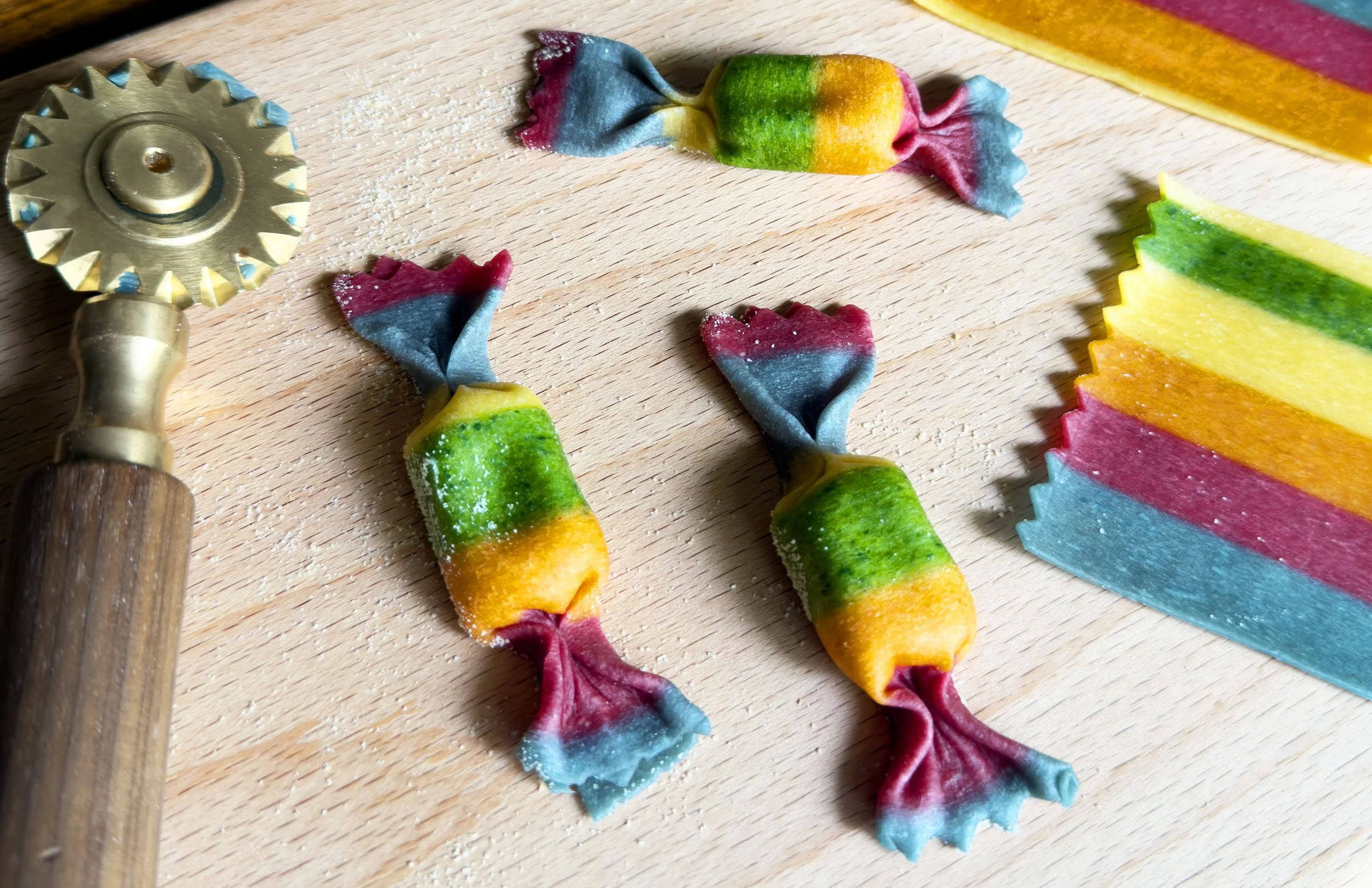 Colorful rainbow caramelle pasta