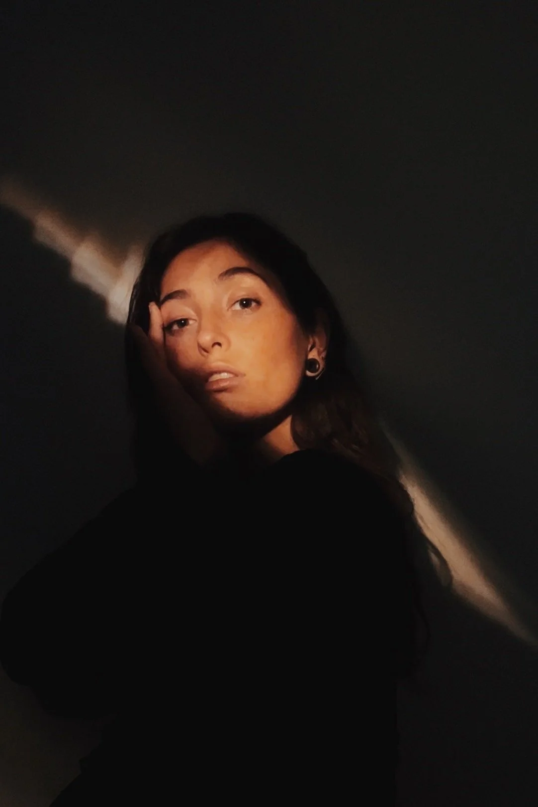 The artist with a ray of sunshine on her face