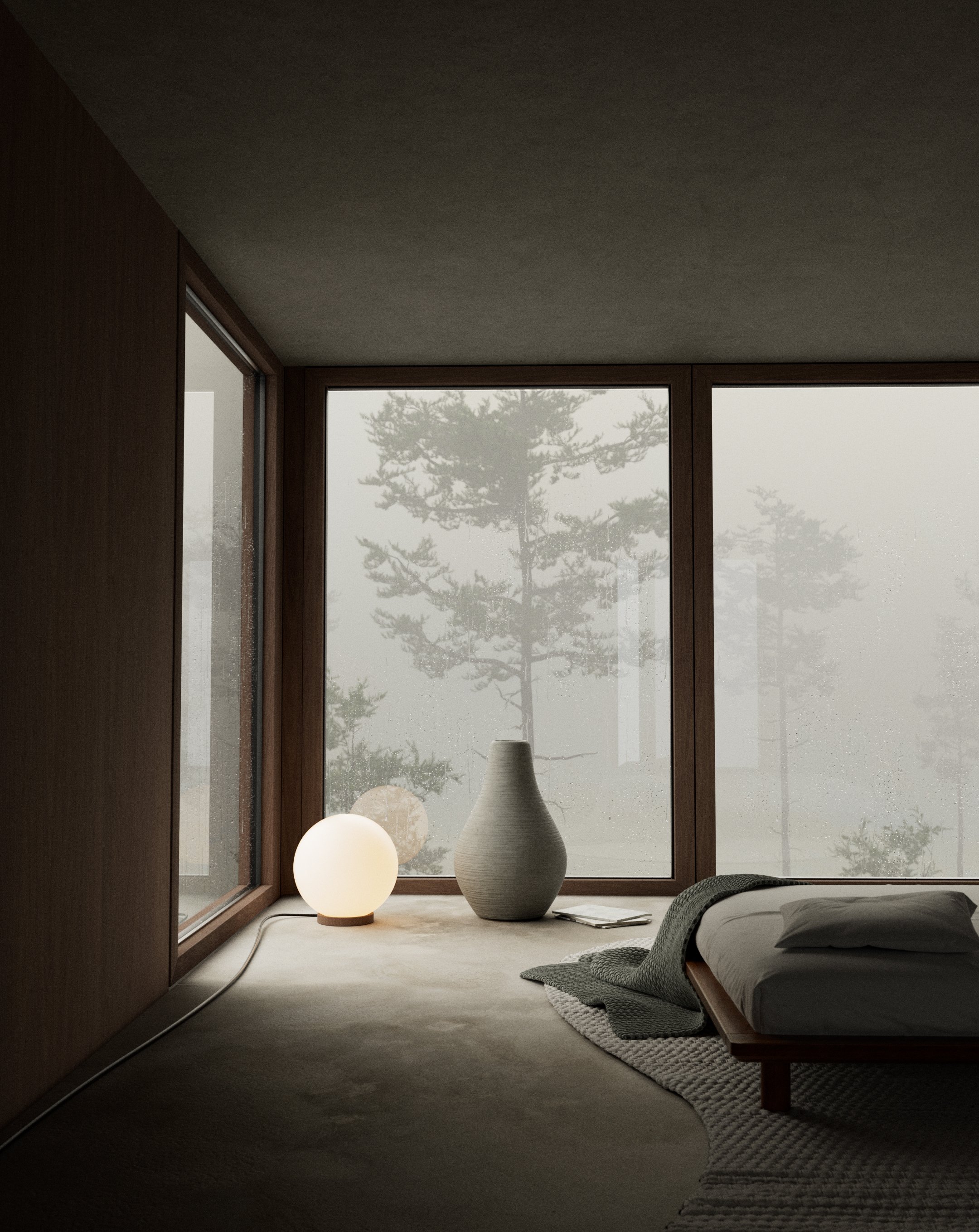 muted foggy rooom with wood walls, big windows, cloud-washed concrete floor, jute carpet, dark green blanket, muji bed, round lamp with warm light and in the middle there is a round concrete vase with a gooseneck at the top