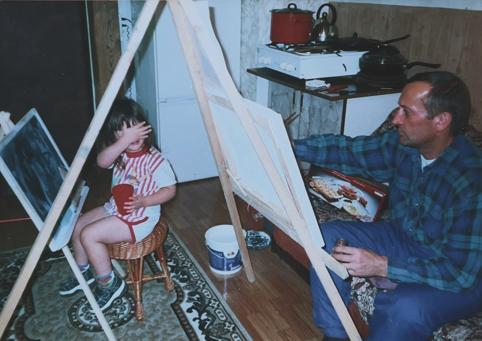 photo from childhood little girl painting with her dad