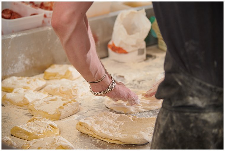 festival-crew-kneading-dough-for-pizza.jpg