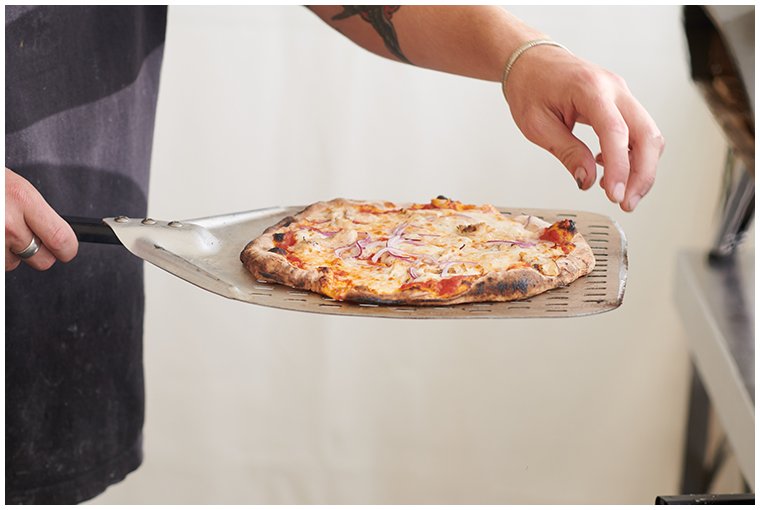 pizza-being-revomed-for-oven.jpg
