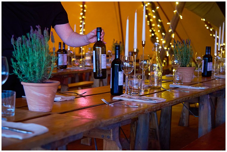 waitess-setting-table-at-glaping-catering-event.jpg