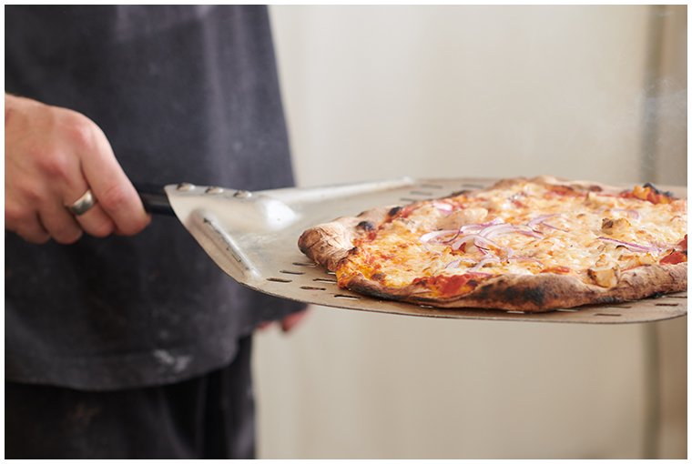 pizza-being-served-on-spatula.jpg