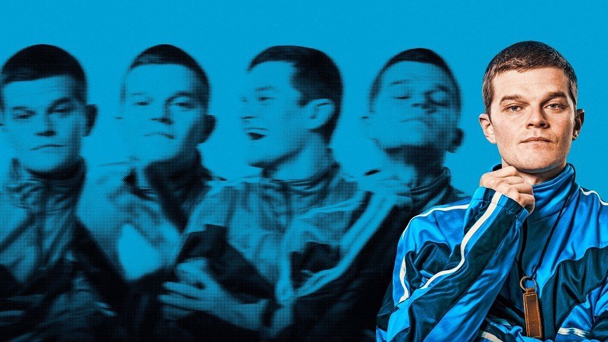 A young man in a blue tracksuit poses confidently with his chin resting on his hand, with a blue background showing multiple blurred images of himself in various expressive poses.