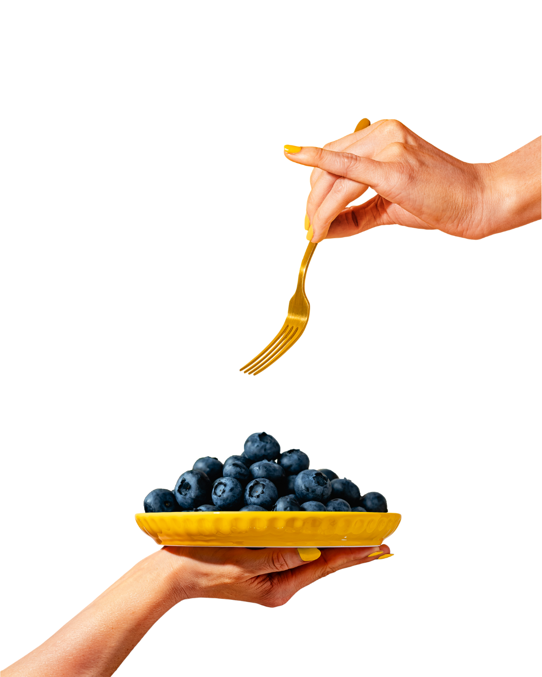 hands holding a fork and a plate piled high with blueberries