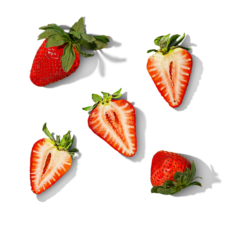 arrangement of five strawberries with some whole and some cut in half