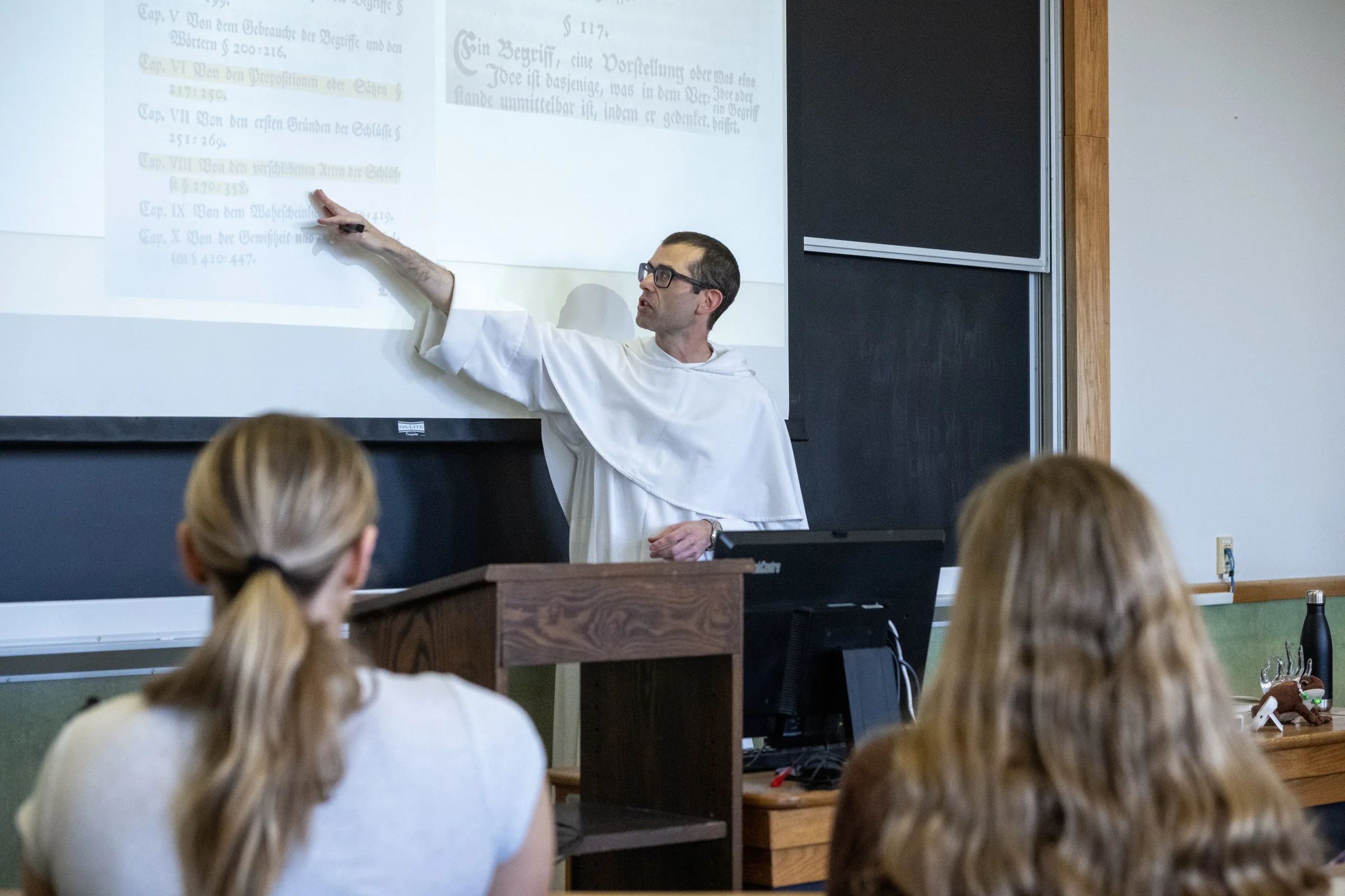 priest teaching class