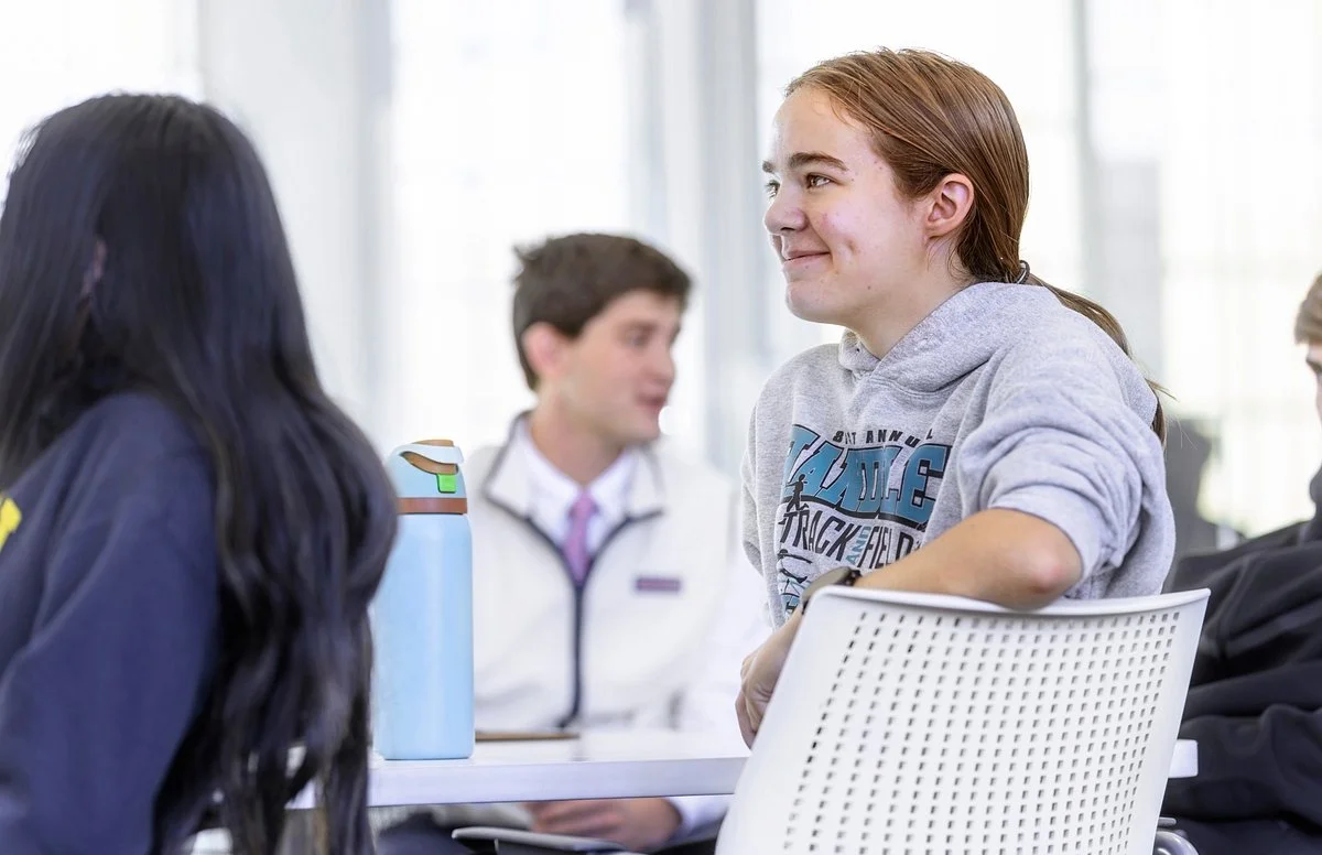 student smiling in class