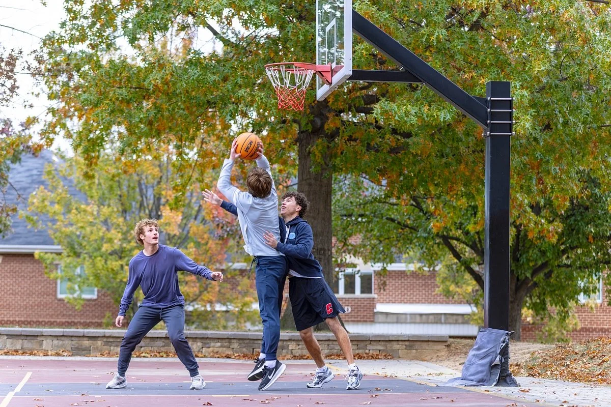 students playing basketball