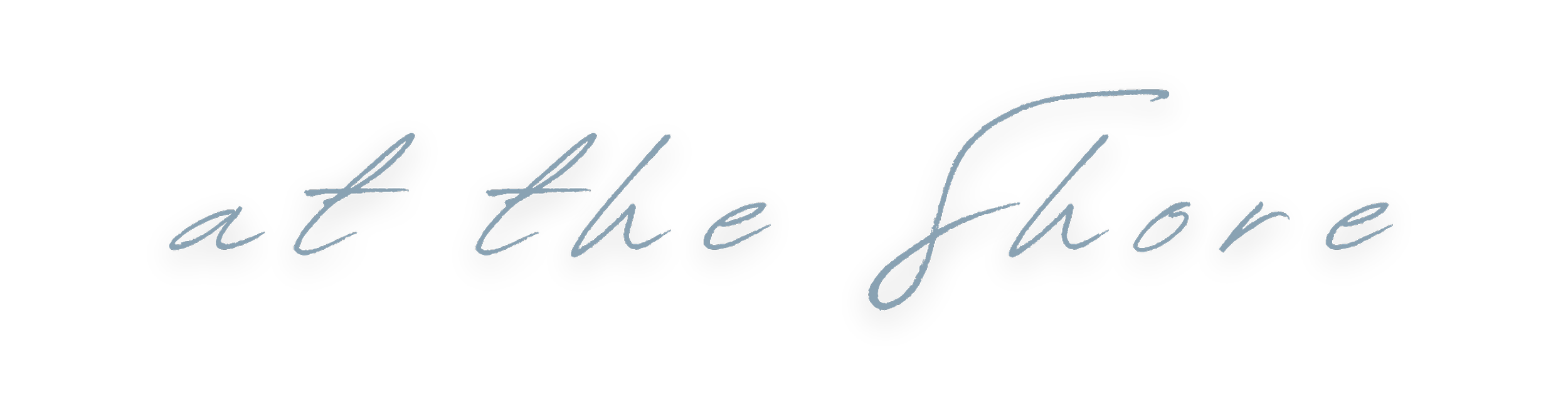 Text that reads "at the shore" in cursive font against a black background.