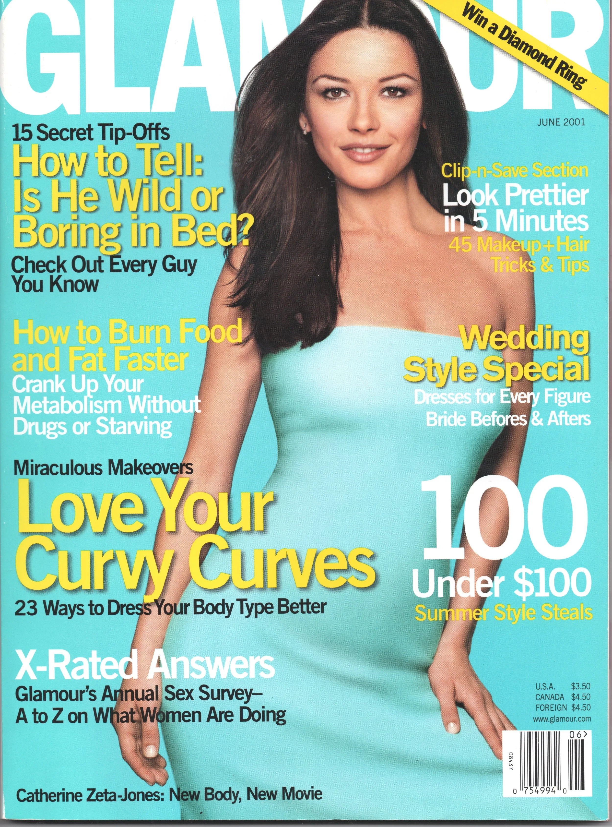 A woman with long dark hair, wearing a teal strapless top, pointing downward with her right hand, on the cover of Glamour magazine June 2001. The magazine includes headlines about beauty tips, fashion, and health topics.