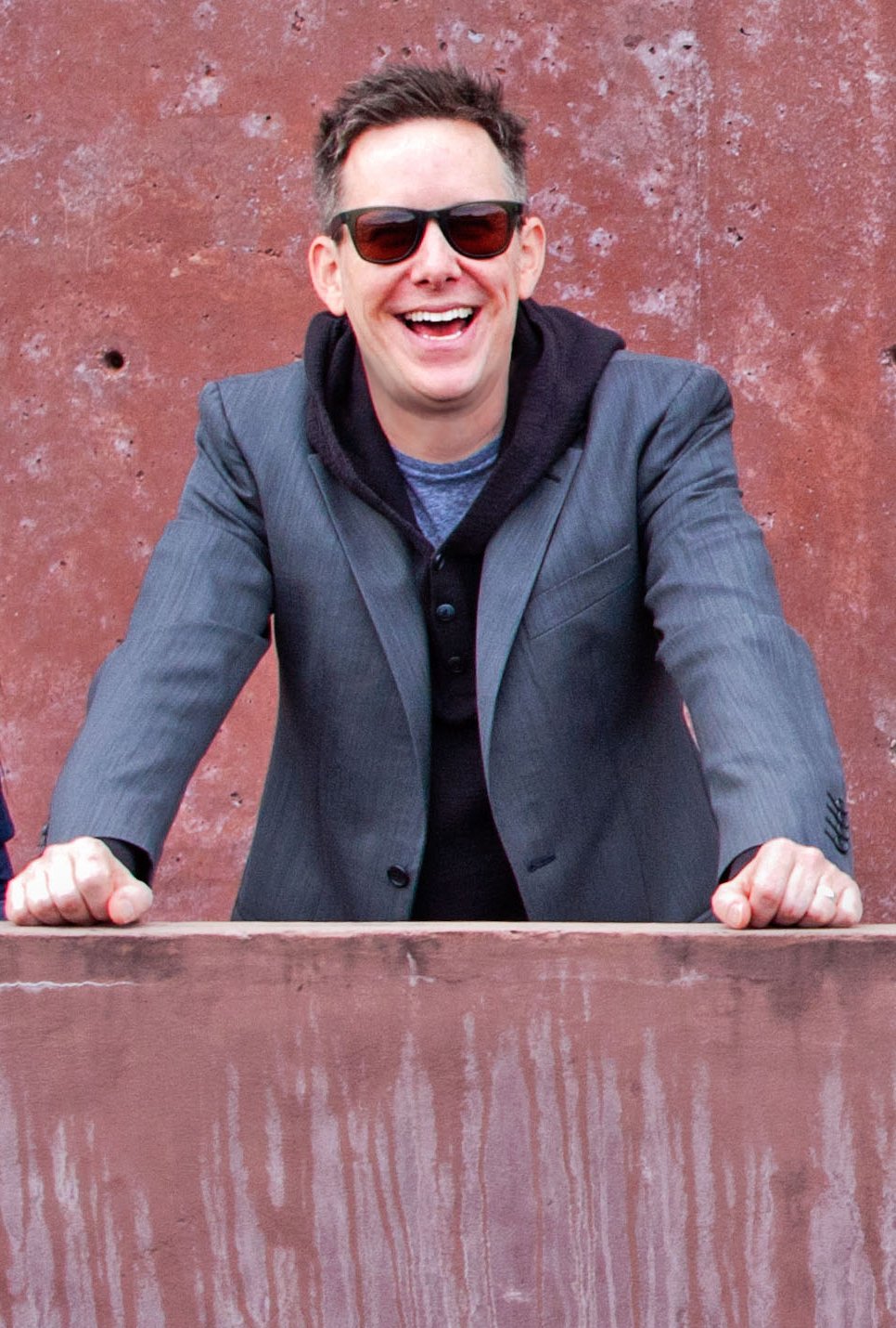 Portrait of a man with brown hair, smiling