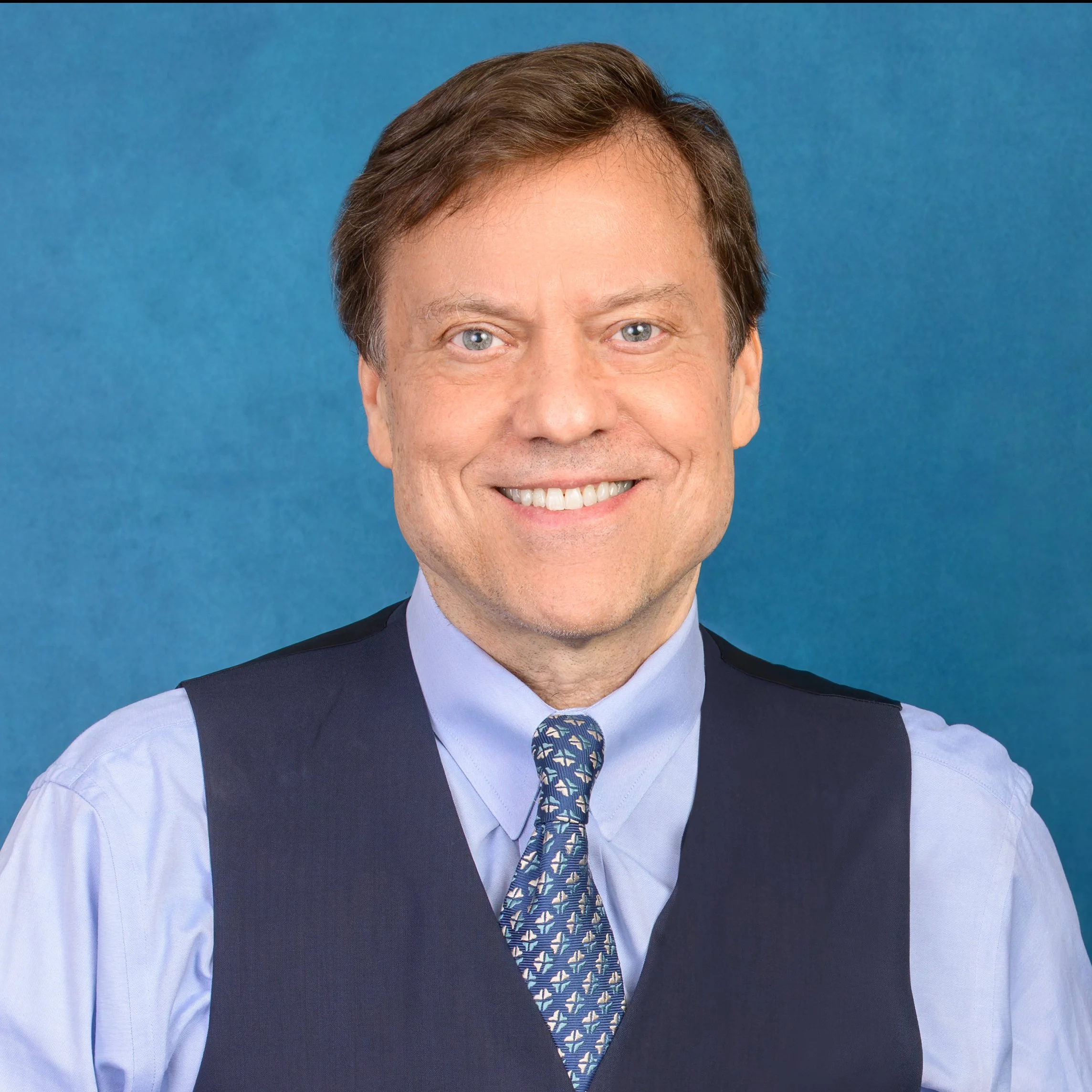 A man in a sweater vest