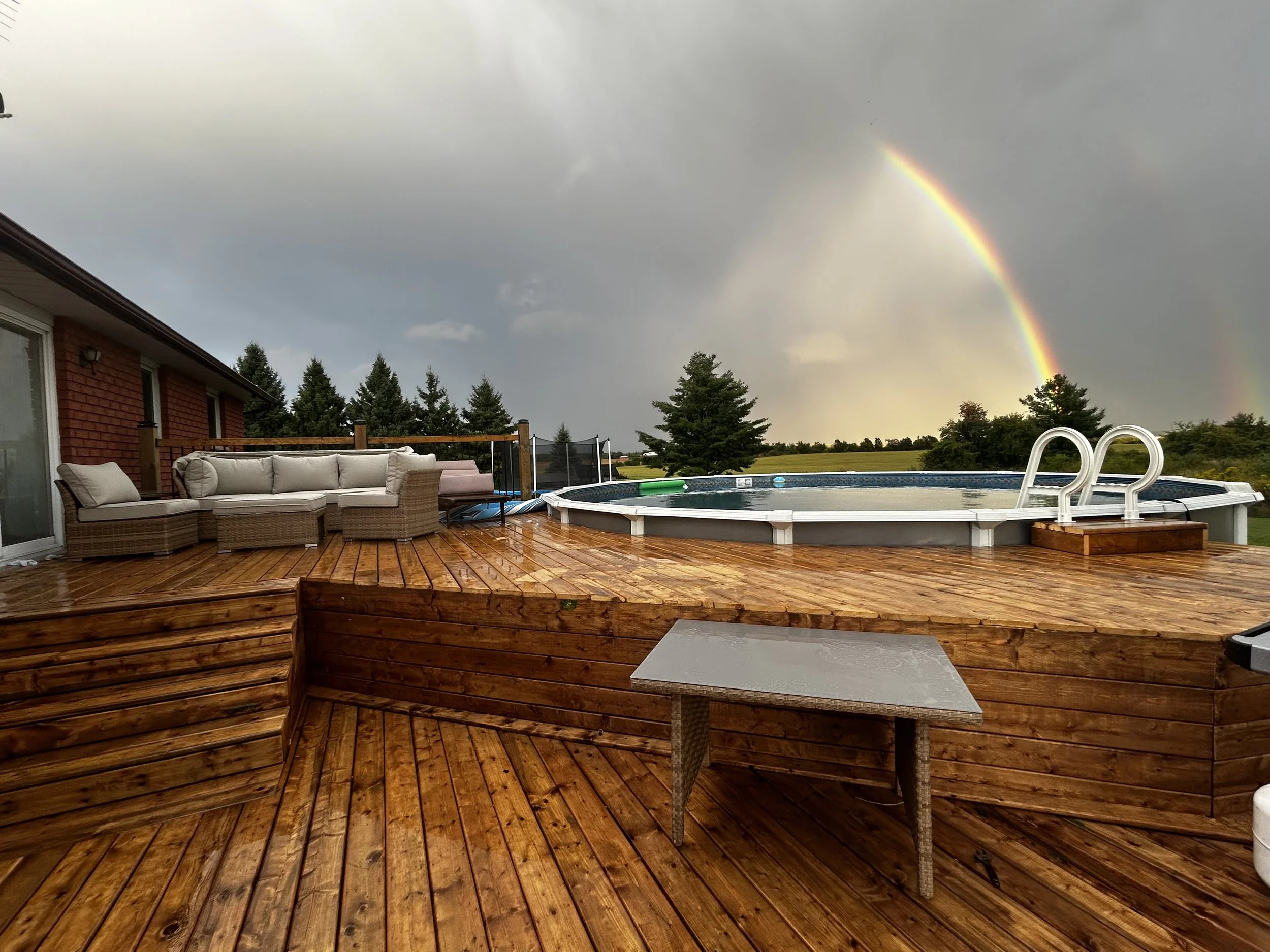 deck and pool with rainbow.jpeg