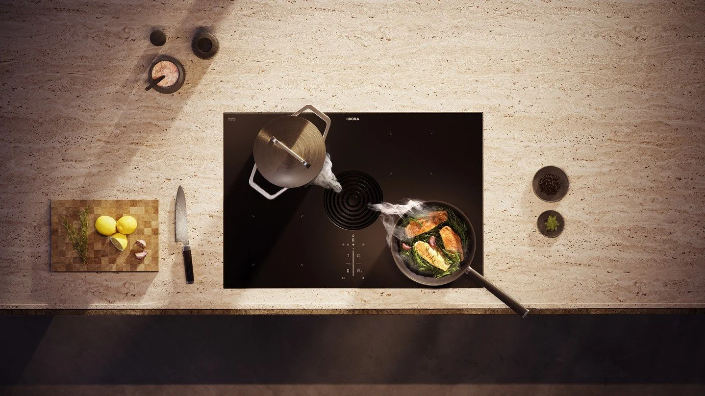 The BORA Pure Rough with matt glass ceramic is not only visually appealing, but also highly functional. ✨ Four induction cooking zones offer space for four pots up to 24 cm in size at the same time. 🥘 The power of the cooktop extractor adapts to the