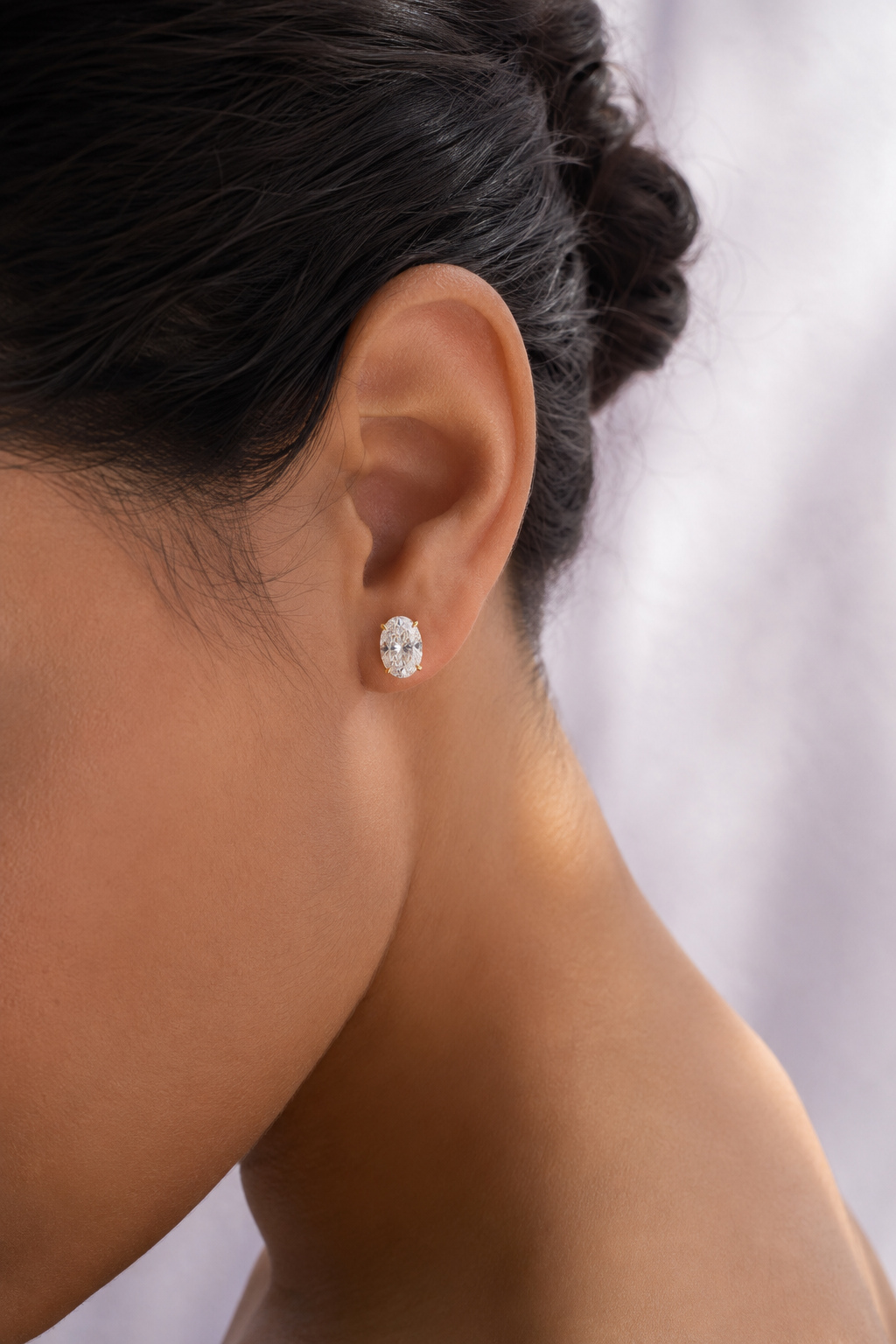 E02_Lifestyle_Yellow-Gold_Oval-Solitaire-Studs.png