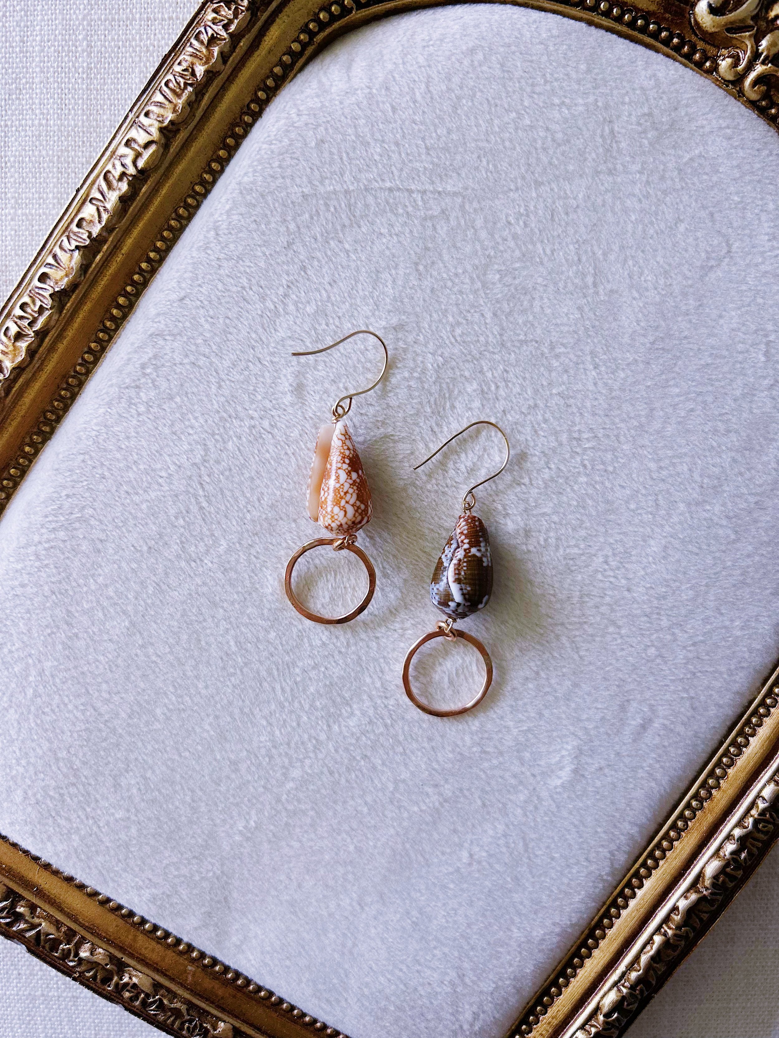 Mismatched Cone Shell Earrings.