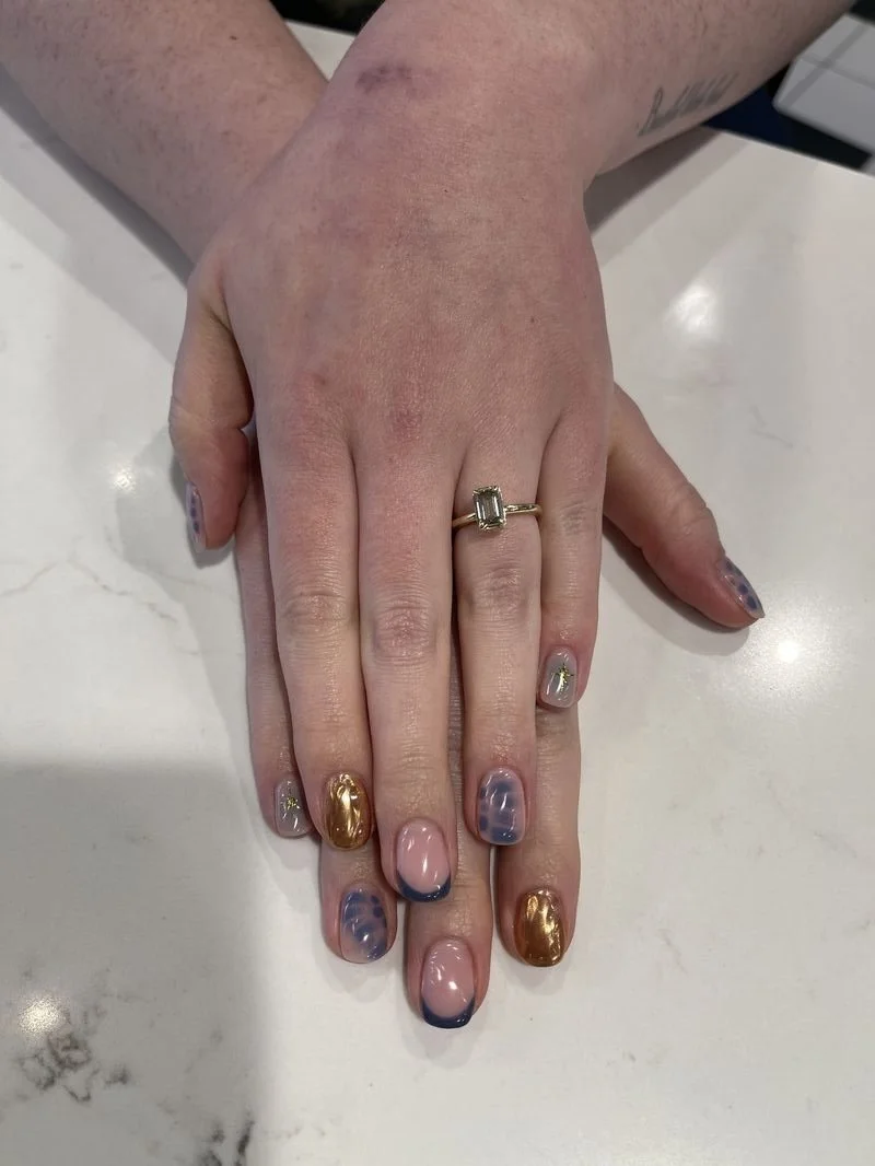 Blooming gel and chrome nail design.