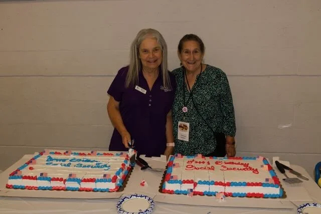 Cutting the delicious cake to celebrate