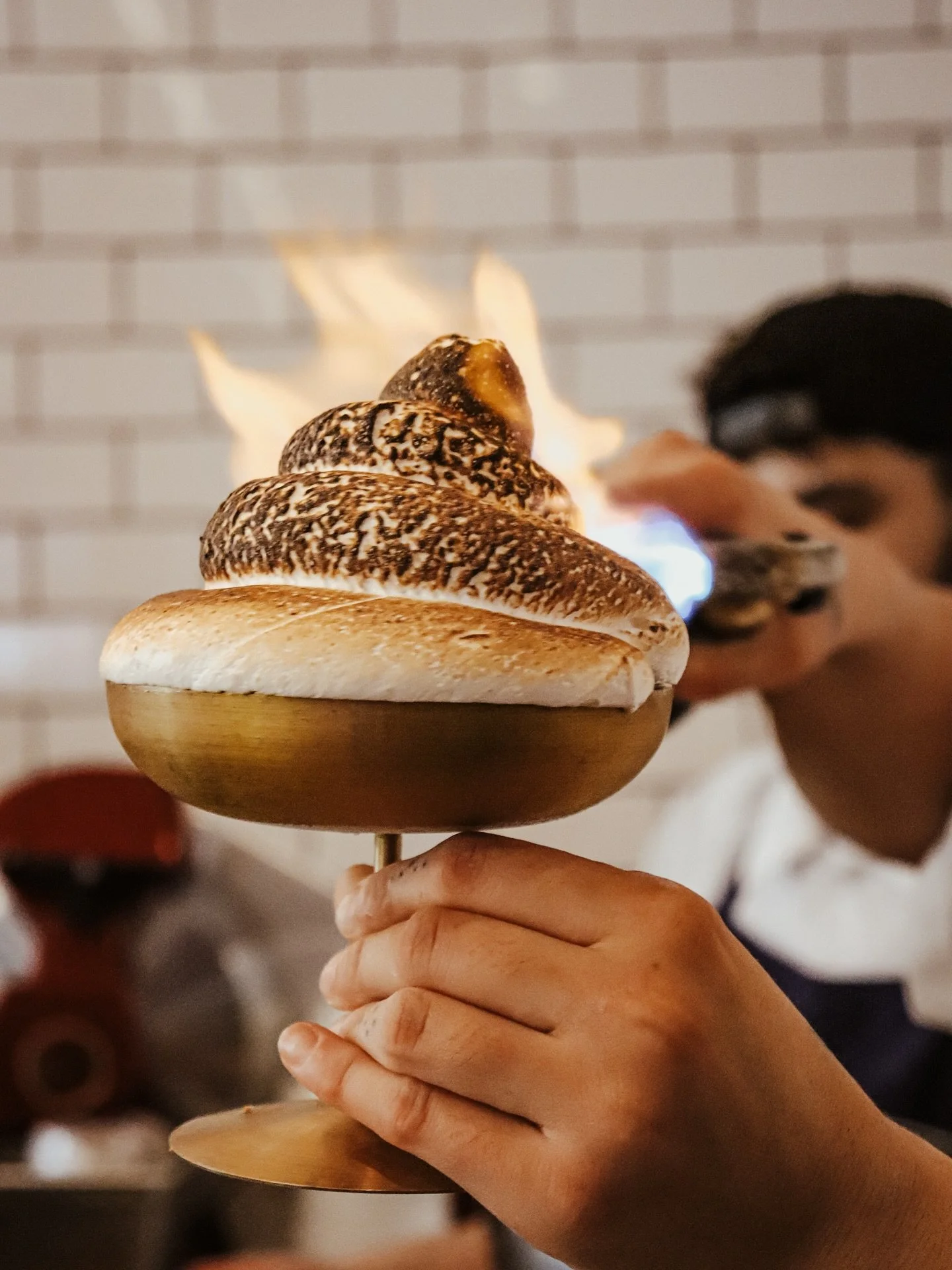 The perfect finish: our baked &ldquo;gelaska&rdquo; 
Vanilla gelato and stone fruit sorbet layered with sponge cake and torched marshmallow 🥄