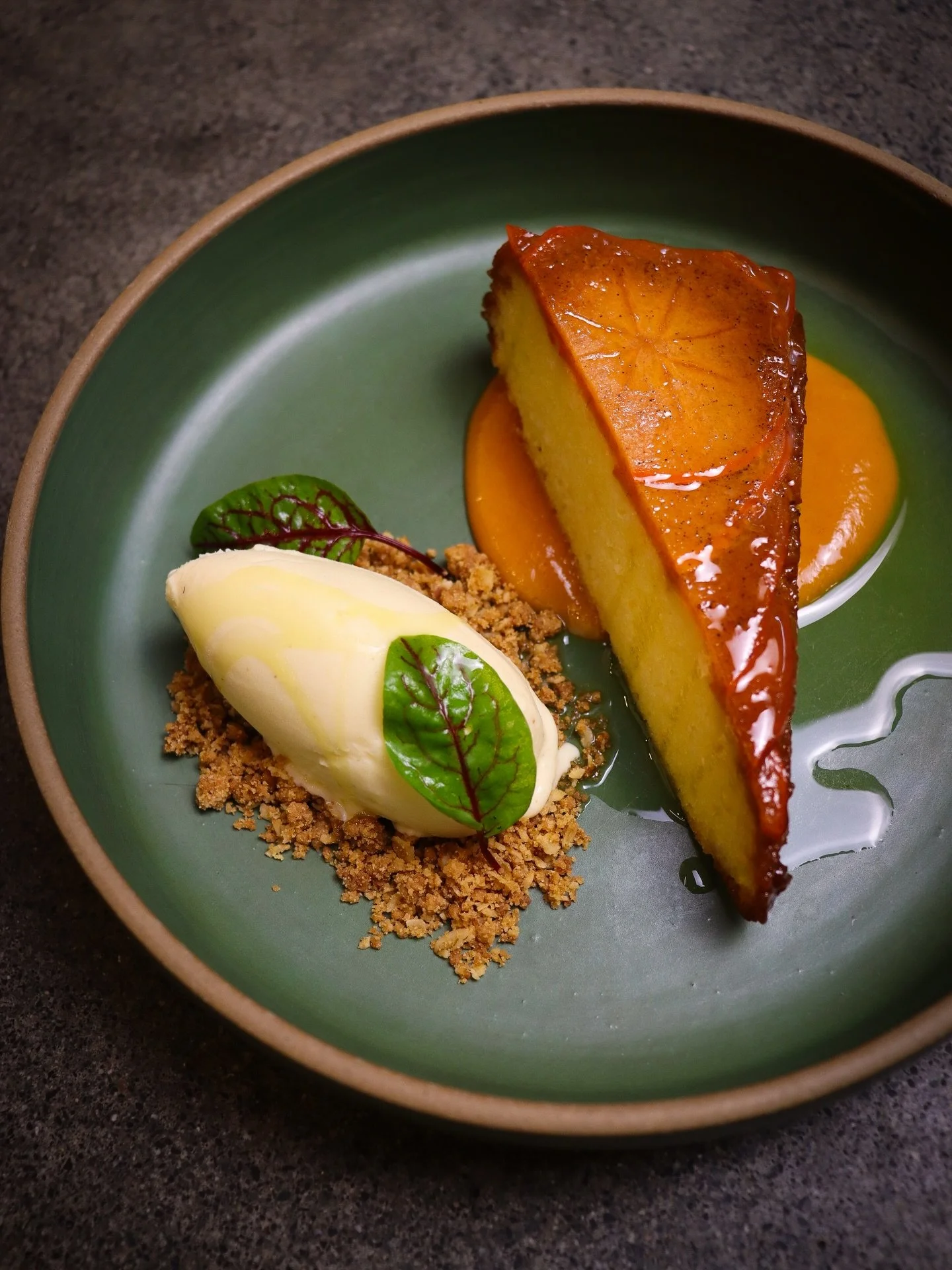 Chef Brooke&rsquo;s newest creation feels like winter in its most thoughtful form. A warm, tender persimmon and ricotta cake glazed to a quiet shine, set over a silky cardamom caramel that pulls the whole thing forward. On the side, her eggnog gelato