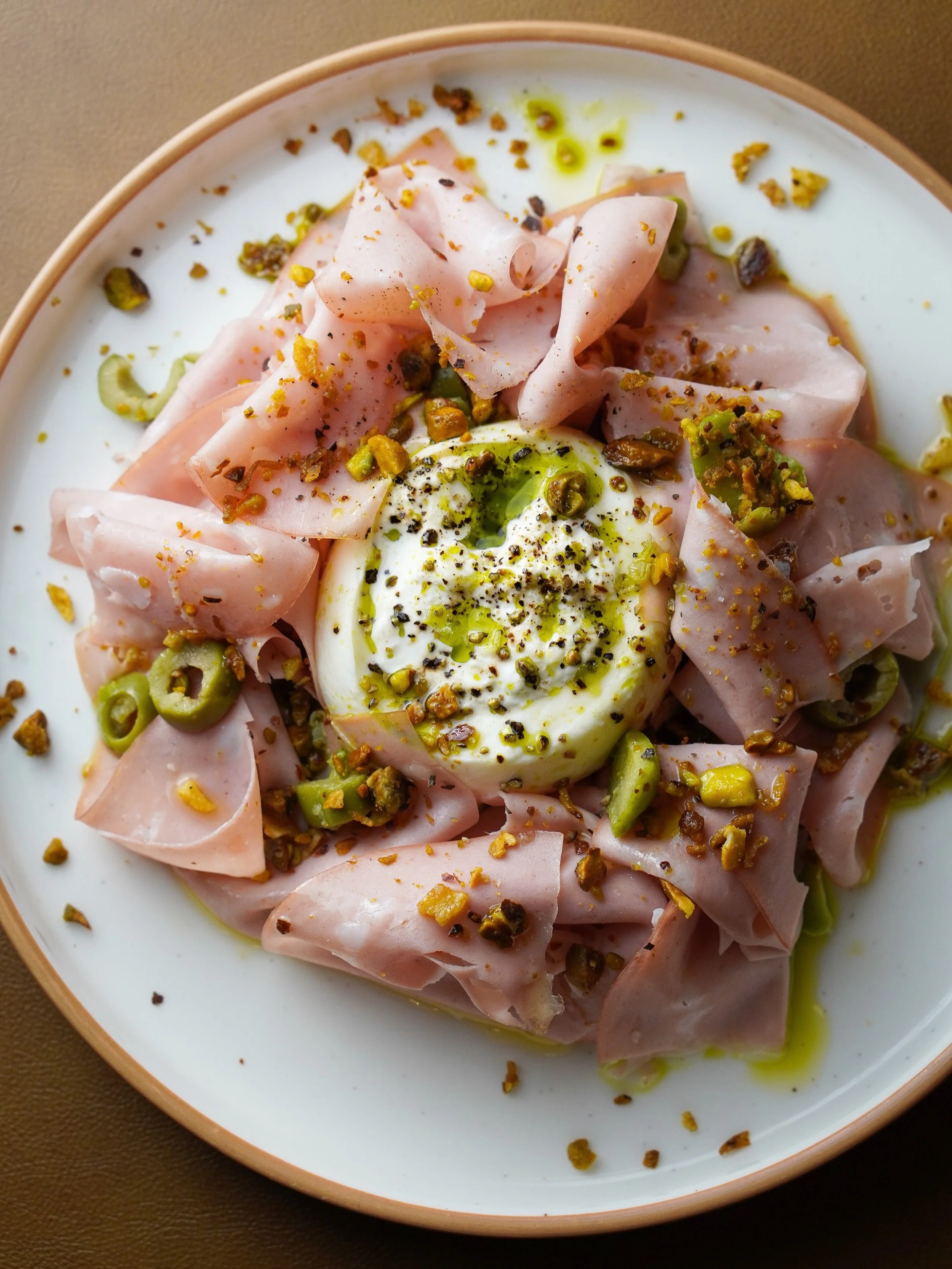 Tonight&rsquo;s main event: imported dairy with emotional consequences. Pick your fighter. Cheese edition. 🧀 

Team 1: 🥊
burrata + mortadella
castelvetrano olives, pistachio, basil oil
smooth-talking heavyweight with a filthy right hook

or

Team 2