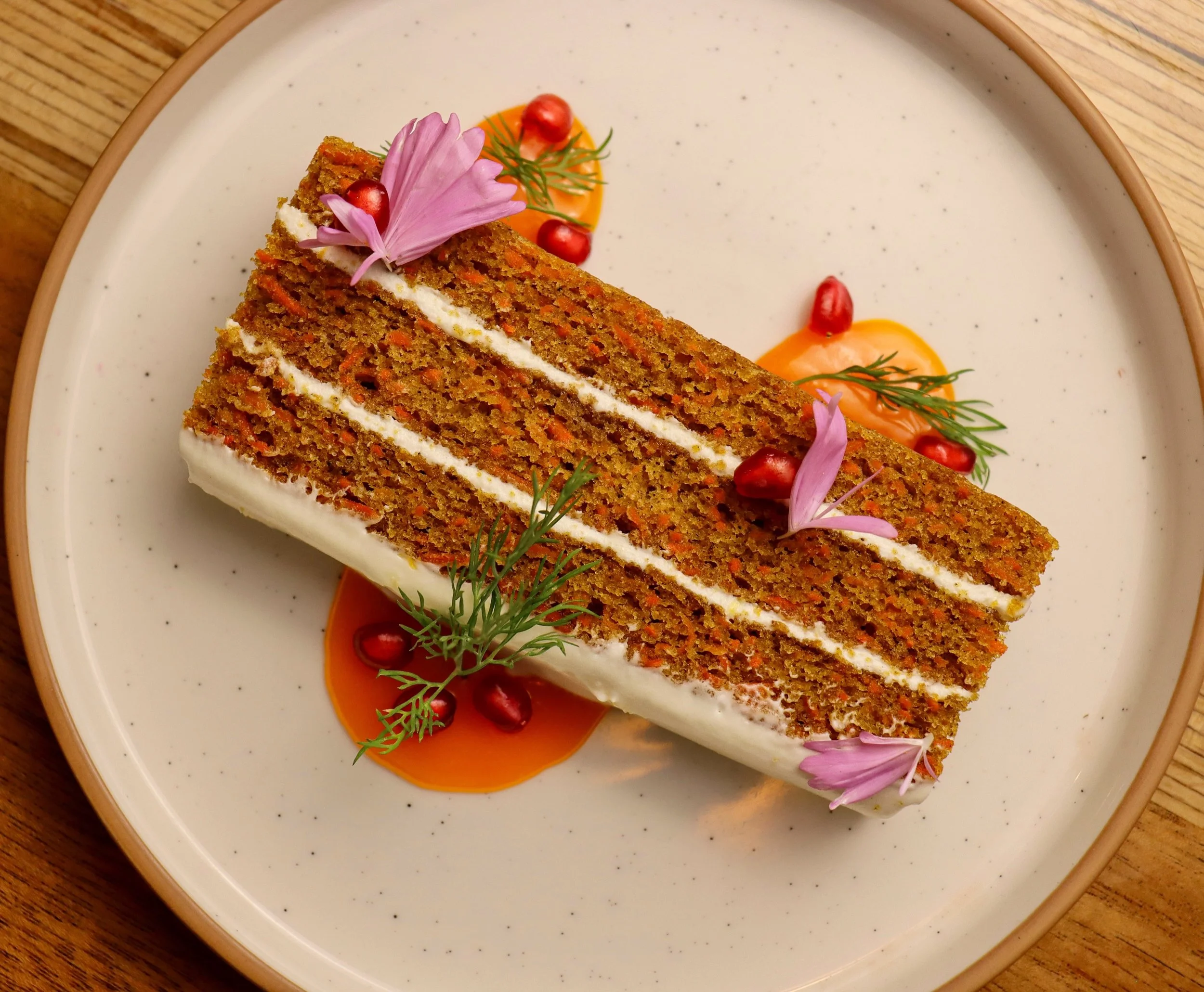 New from Chef Brooke: 🥕carrot cake |  warm spices | whipped cream cheese | carrot caramel | pomegranate
