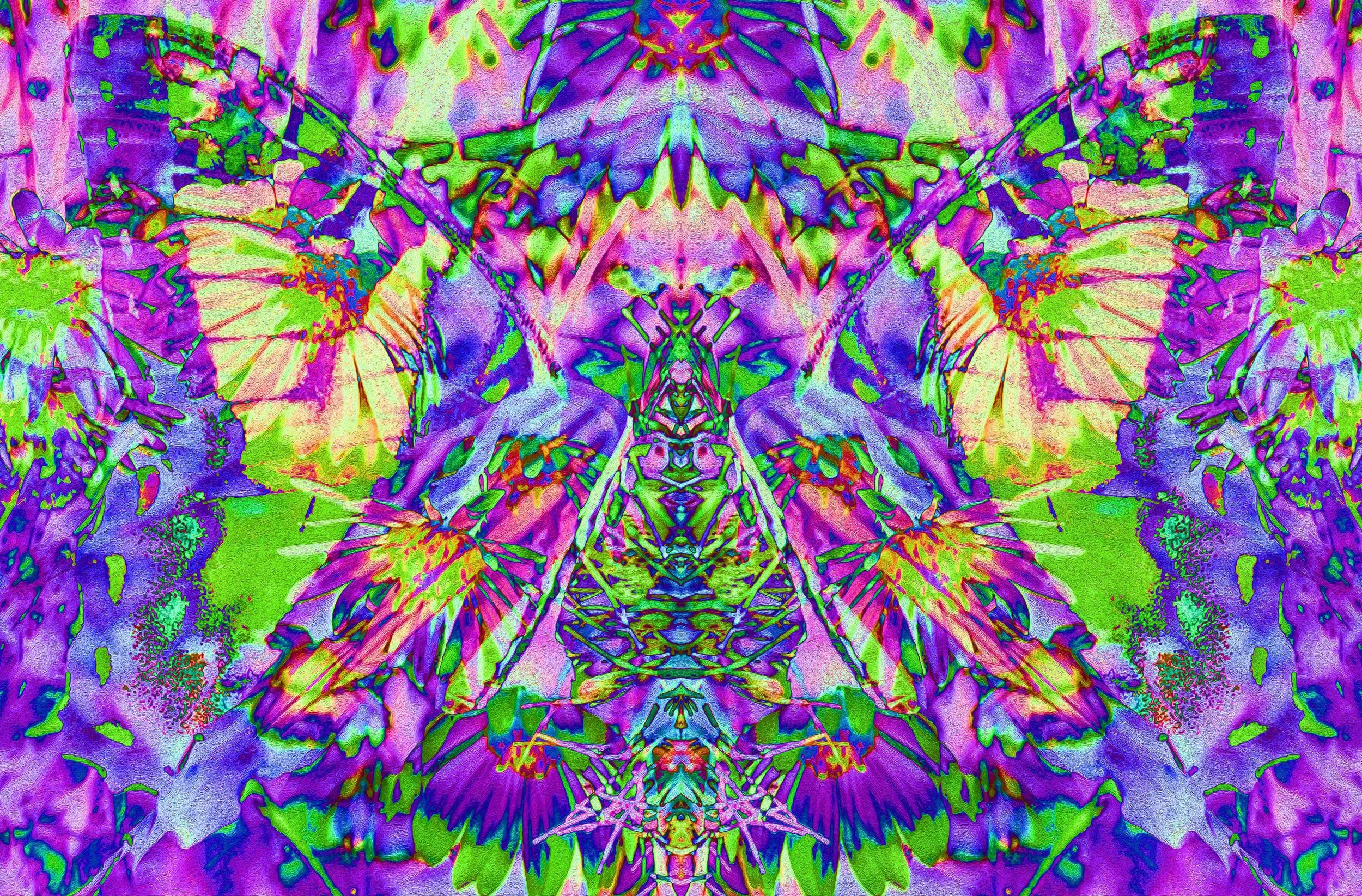 A highly abstract, colorful, symmetrical image with neon purple, green, pink, and blue hues, resembling a mixture of organic and geometrical forms.