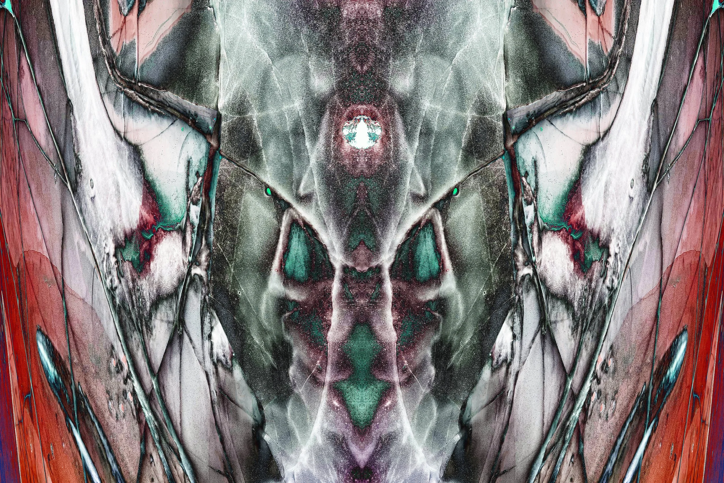 Abstract symmetrical artwork with swirling patterns in shades of green, red, white, black, and hints of blue.