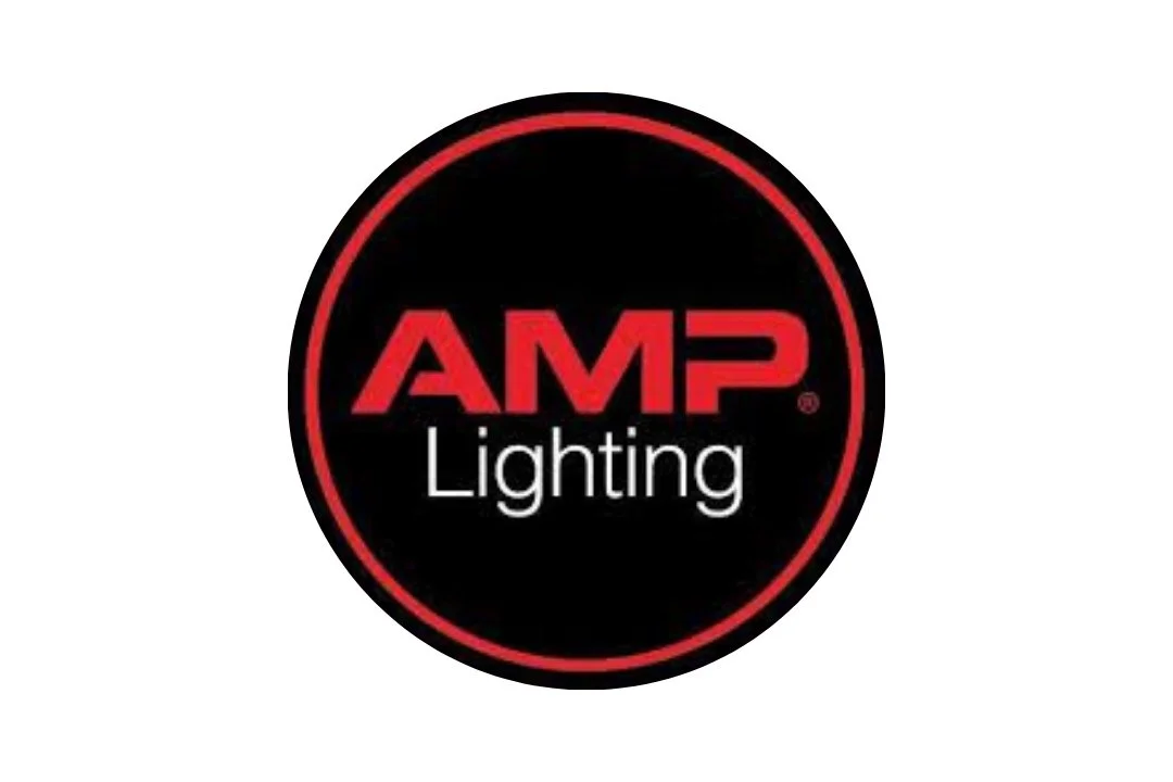 A circular logo with a black background, red border, and the words 'AMP Lighting' in red and white text.