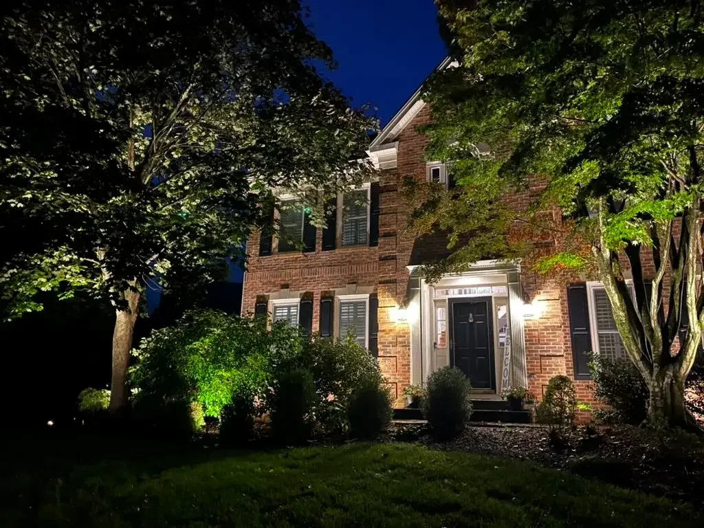 This Leesburg home is illuminated with strategic facade and tree lighting.