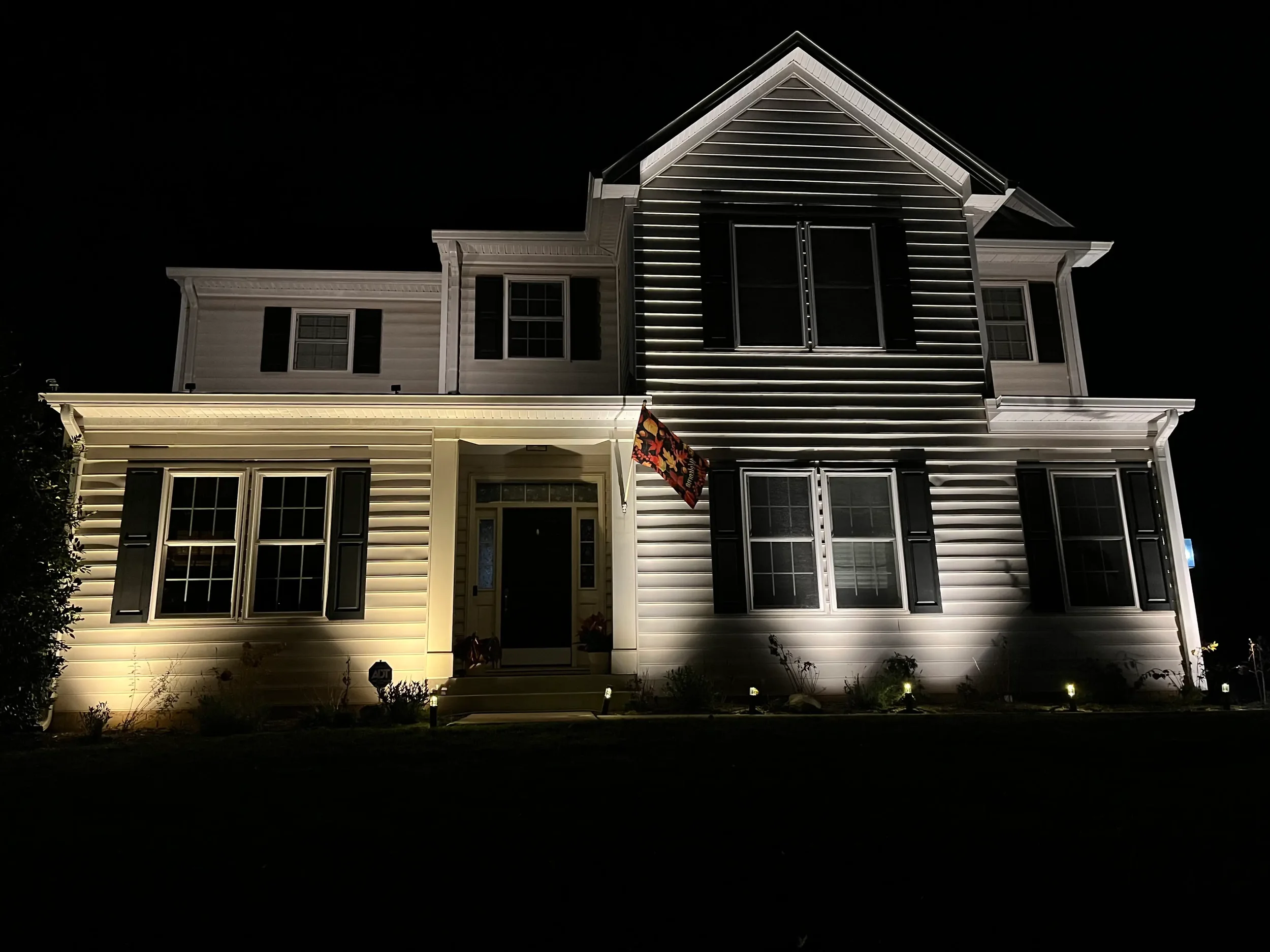 Home illuminated with 2700K and 3000K outdoor lighting to compare color temperatures.