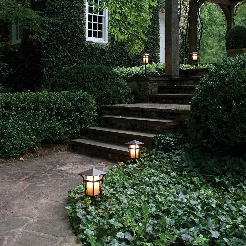 Pagoda style market path lights blend with surroundings while functionally illuminating as darkness falls.