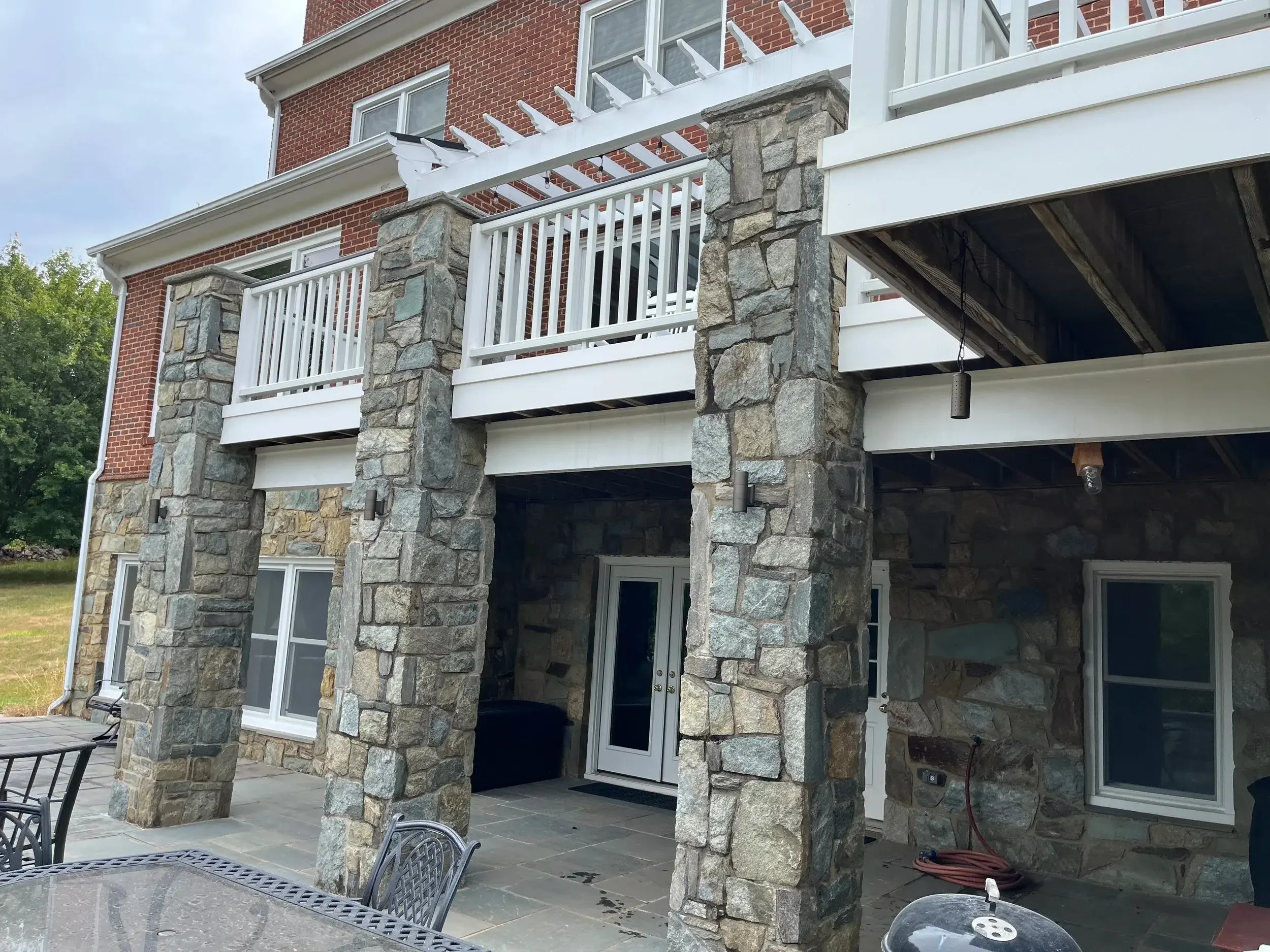 These brass up/down lights blend seamlessly with the stone features of northern Virginia homes and hardscapes.