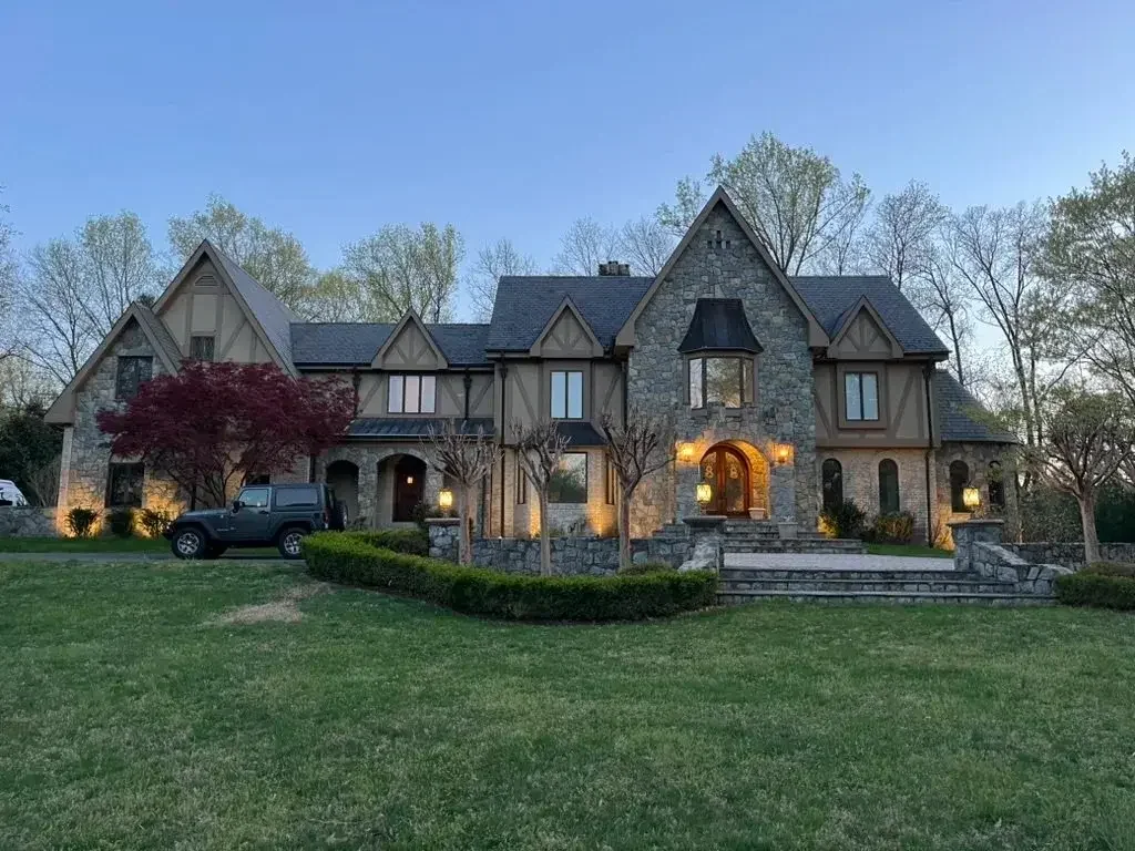 Great Falls estate with ground-mounted fixtures, before Loudoun Lighting re-design.