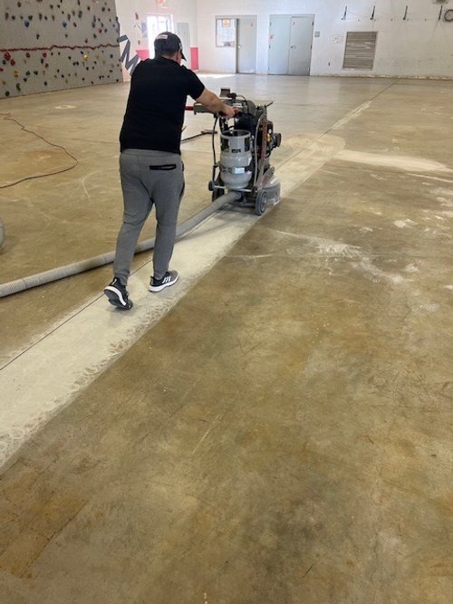 DMI prepping floors with grinding