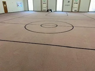 Large scale floor demolition performed on a gymnasium by DMI.